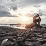 Surviving in Extreme Heat: The Hydration Mission man-sat-bent-his-knees-base-tree-where-floor-was-dry-hands-placed-head_1150-16337